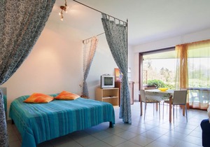 Attractive studio with terrace and garden, pool and dream view
