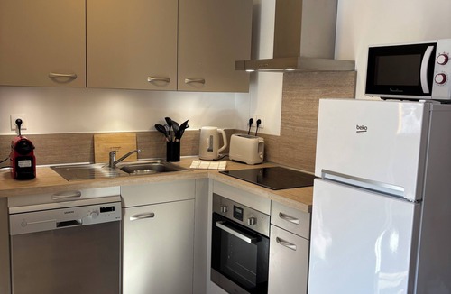 La Joue du Loup Apartment | Centrally located and cozy apartment in La Joue du Loup: sleeps 6, 2 bedrooms, 4 beds
