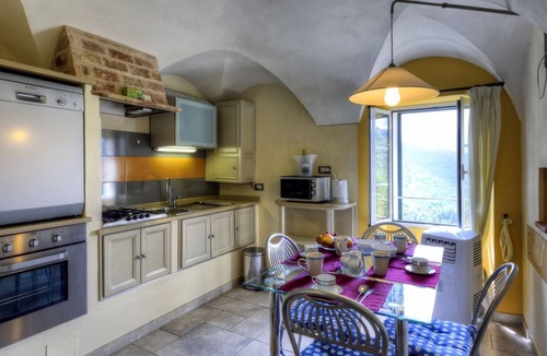Civezza Apartment | Cozy apartment "La Piazzetta" in a building with a garden and swimming pool.