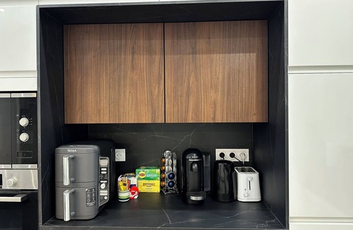 Mantega Apartment | Luxury New Apt 2BR/2BA AC 4-6 Guests Free Private Garage Tram Wi-Fi
