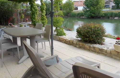 La Taillee House | Marais Poitevin, riverside vacation rental, FISHING, rowboat, bicycles, fireplace, bocce court