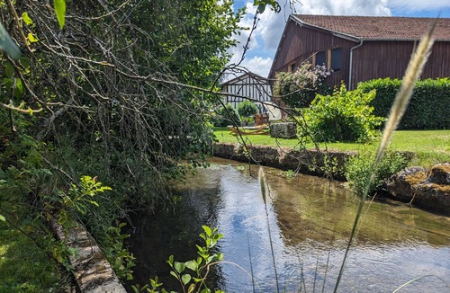 Louvemont Cottage | Riverside Retreat: Cozy 3BR with Modern Kitchen, Garage & Village Charm