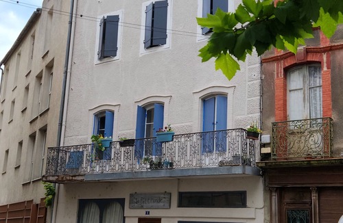 Quillan House | Tout le Monde: A grand balcony overlooking town square in the heart of Quillan!